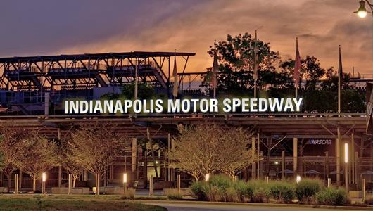 An image of the Indianapolis Motor Speedway's famed Gate 1 at sunrise