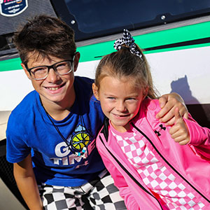 Fans pose in pit lane