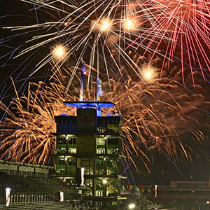 The pagoda is backlit by fireworks