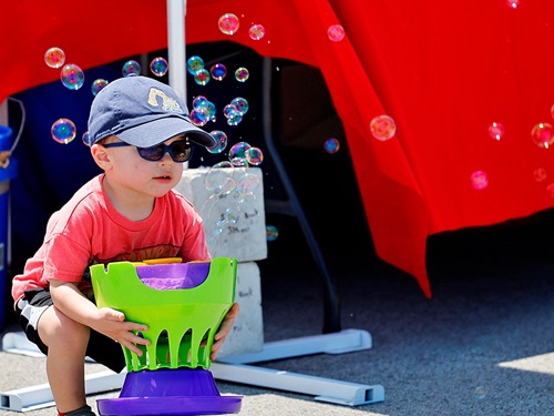 a child plays with bubbles