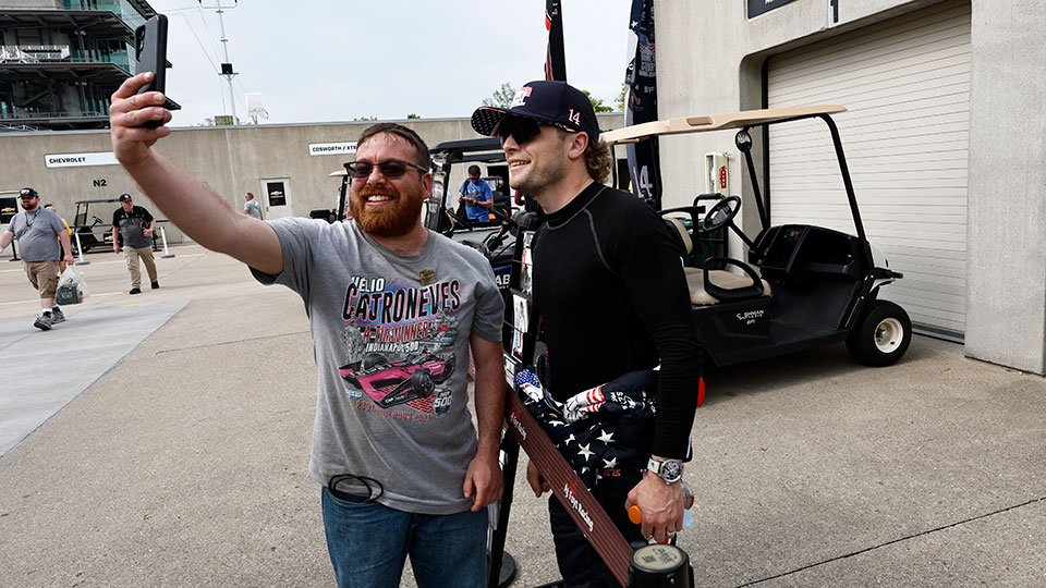 A fan takes a selfie with Santino Ferrucci