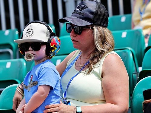A mother and child in the stands at the Indianapolis Motor Speedway.