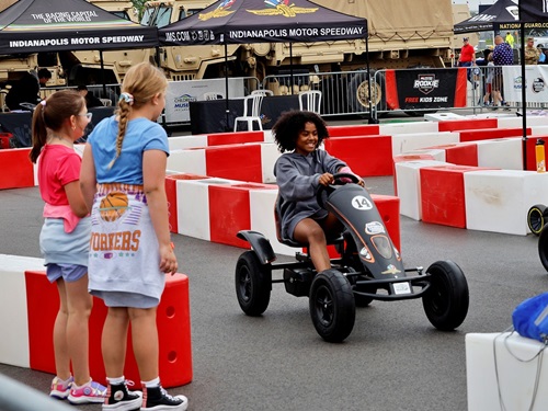 A child plays in the Kid Zone of the Fan Midway at the Indianapolis Motor Speedway.