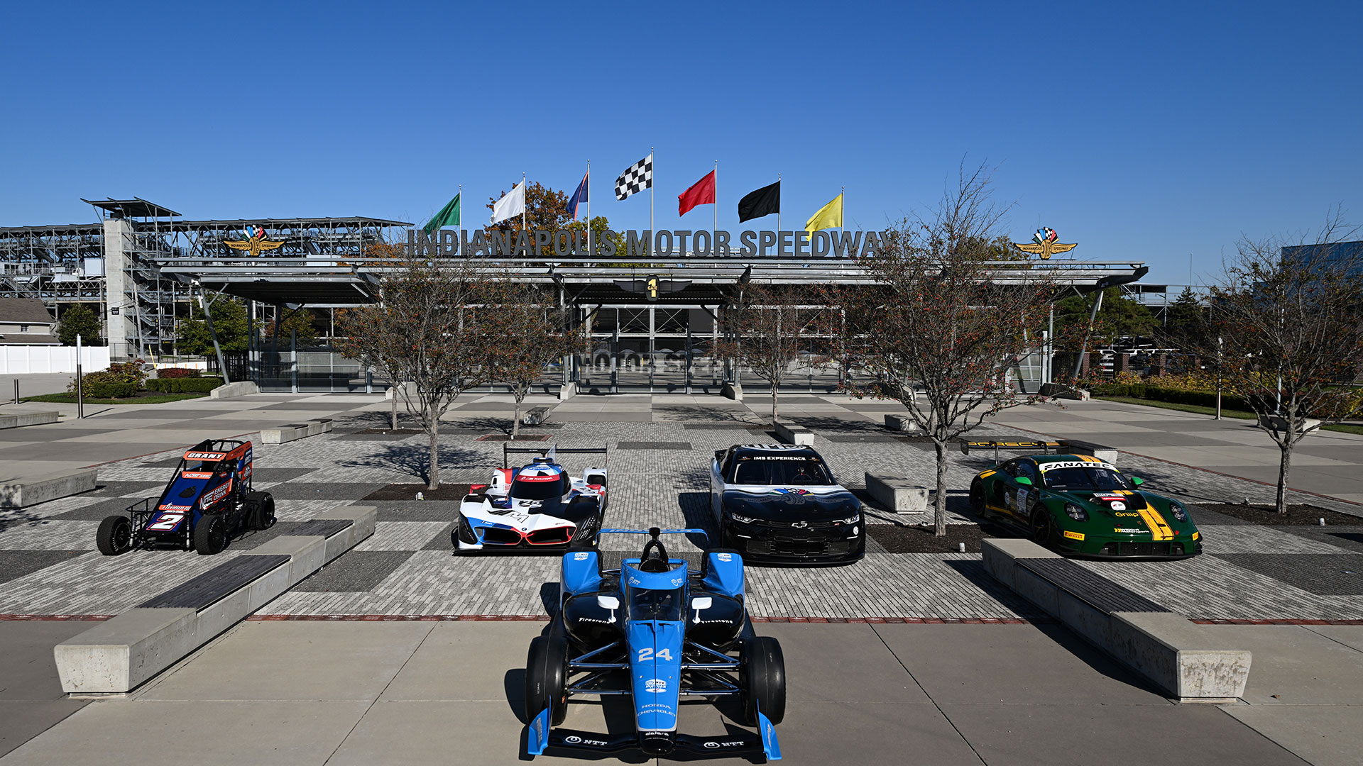 Cars of the Marquee events line up in front of Indianapolis Motor Speedway