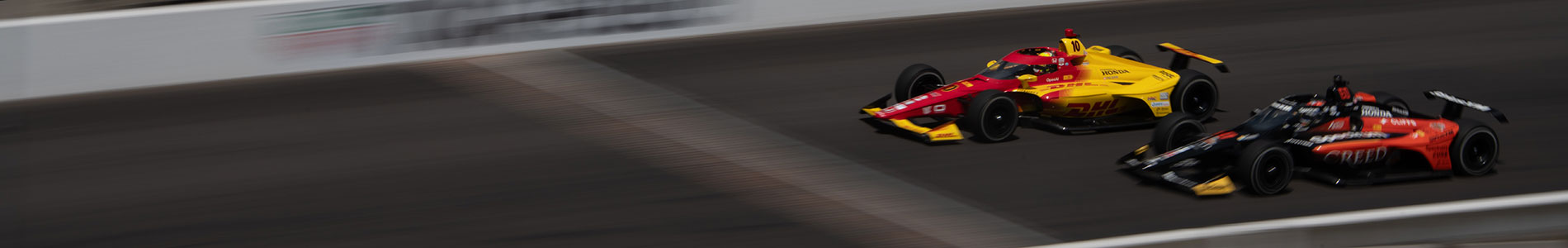 Palou and Rosenqvist cross the yard of bricks