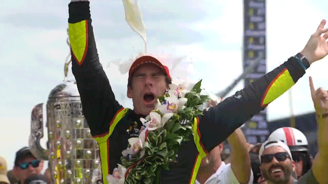 Simon Pagenaud celebrates with milk in Victory Lane at the Indianapolis 500